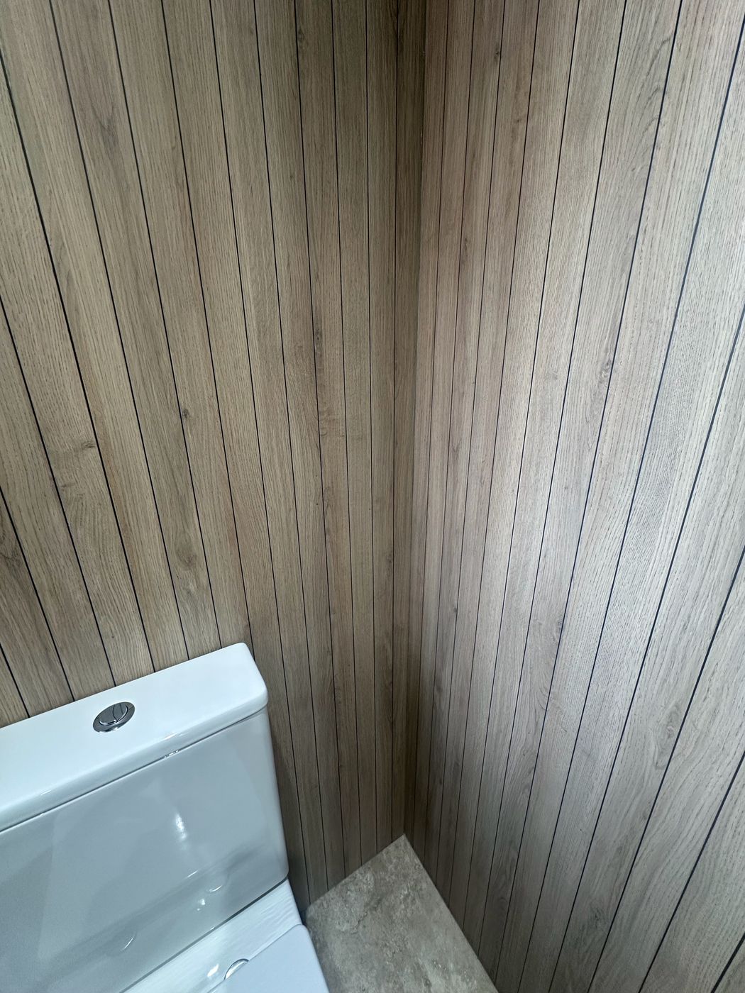 Bathroom with oak vanity, marble-effect tiles and vertical oak slat wall