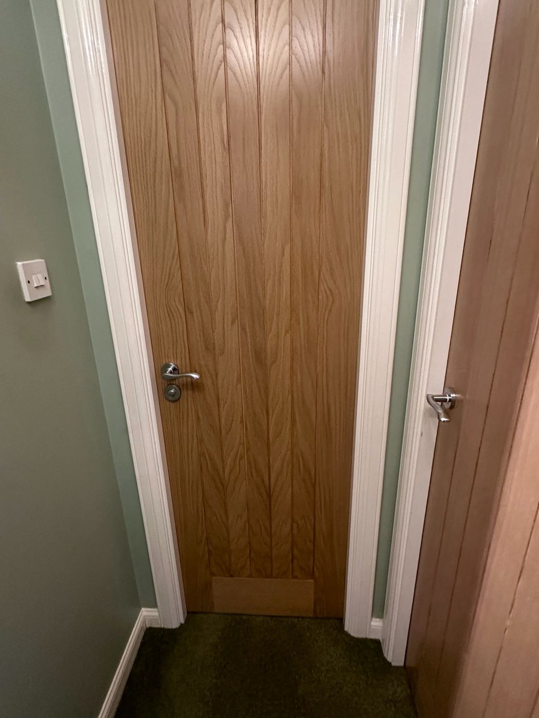 Built-in grey wardrobes with oak door joinery